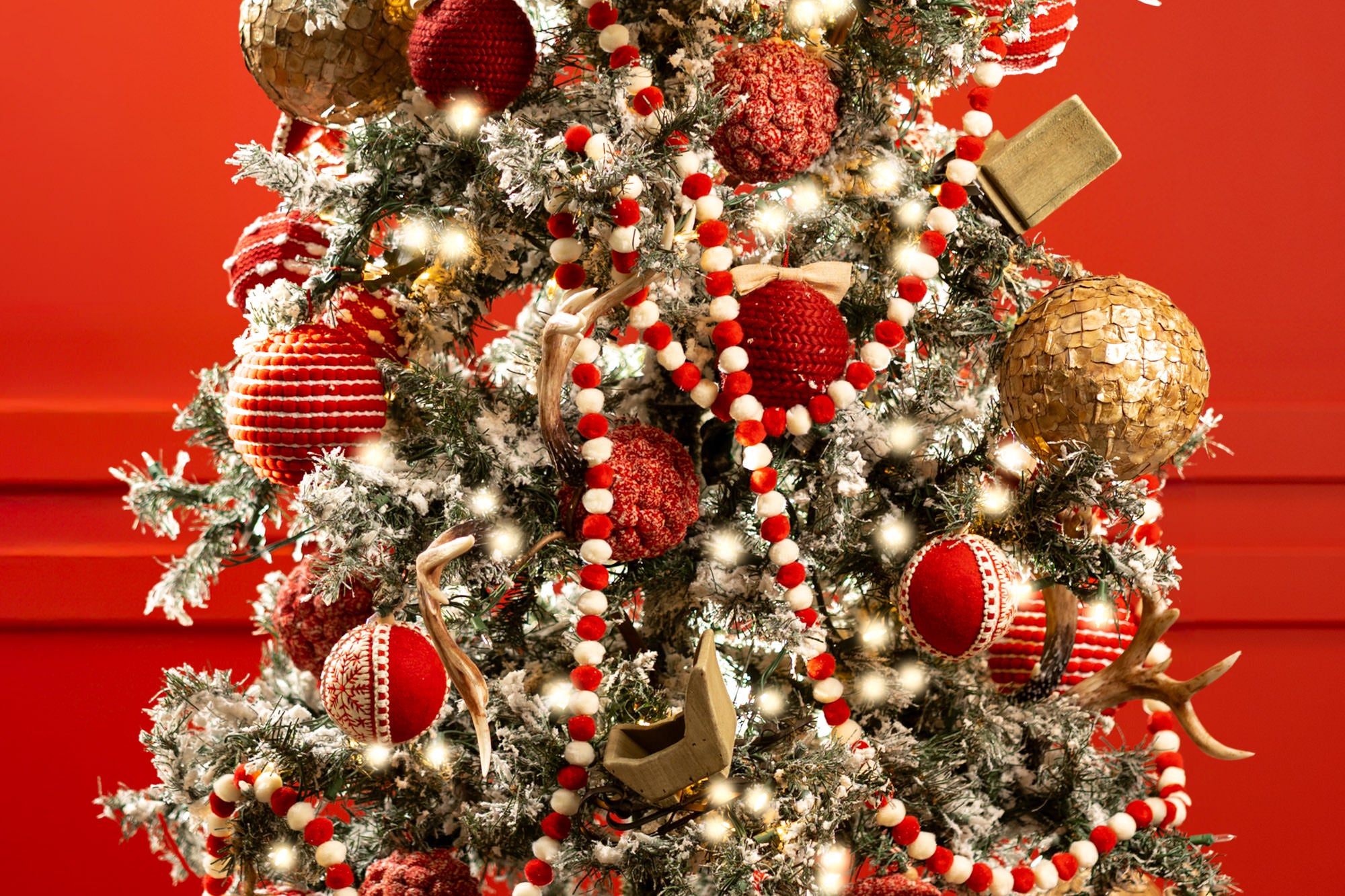Retro Christmas decorations - red and white Christmas ornaments on reindeer tree