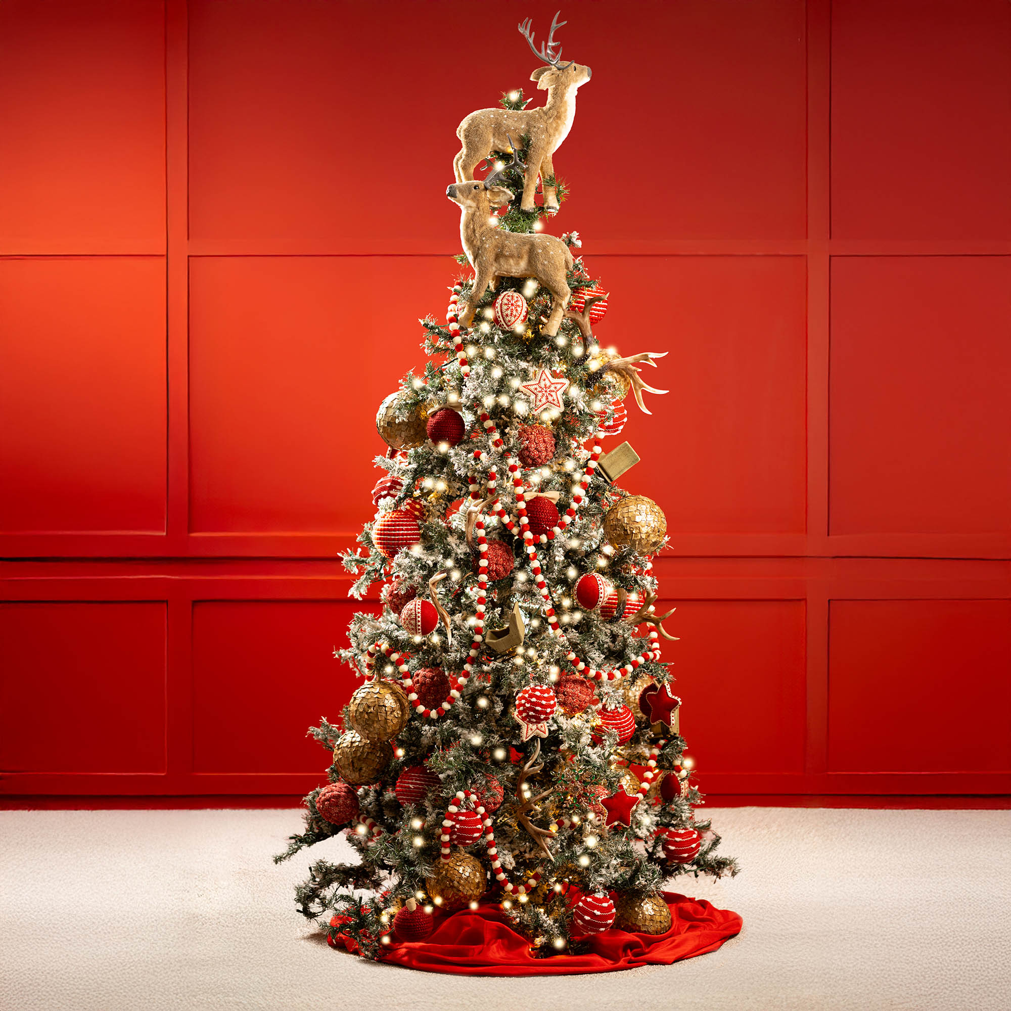 Retro Christmas decorations - red and white Christmas ornaments on reindeer Christmas tree
