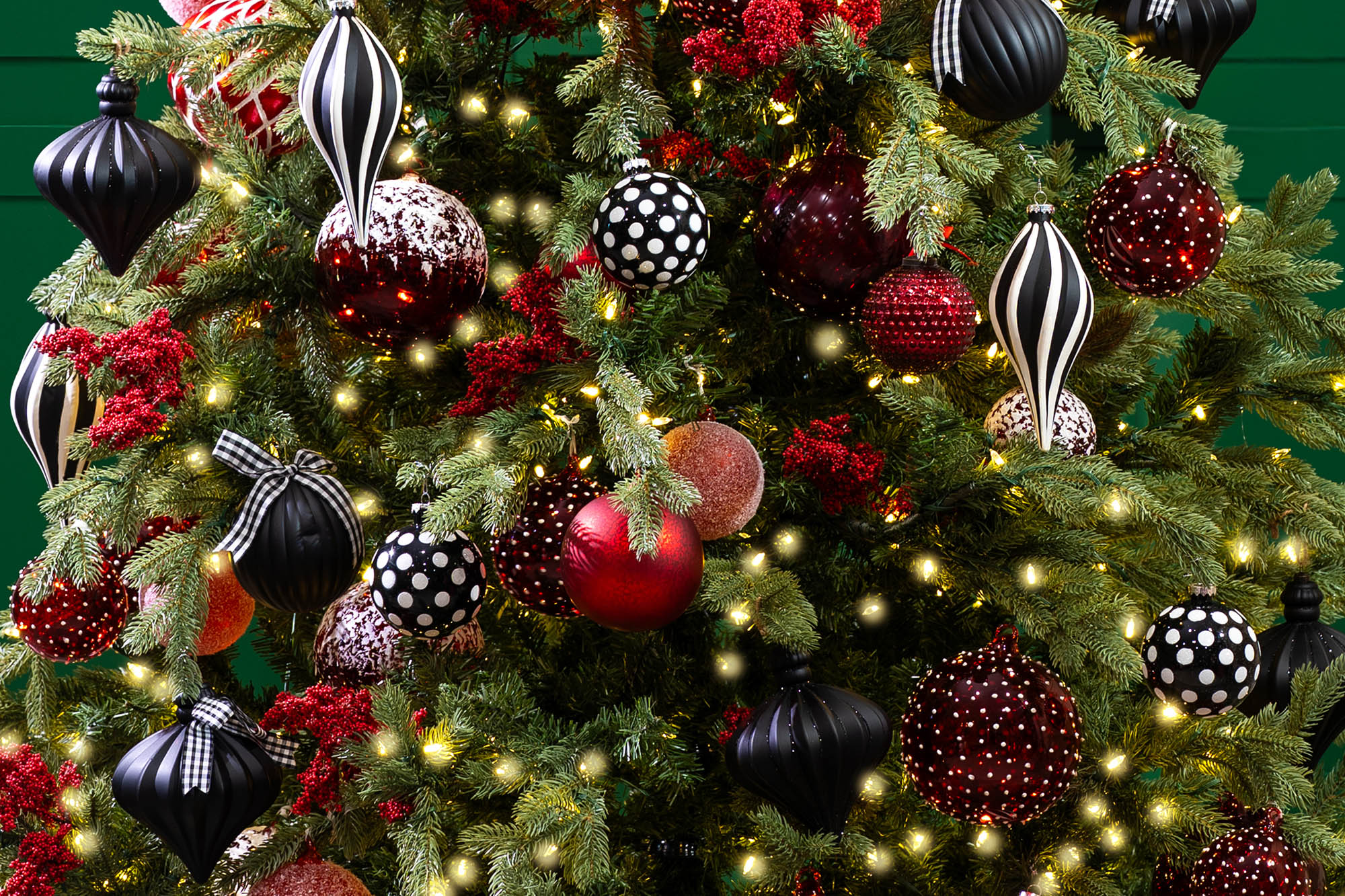 black and white Christmas tree with red ornaments 