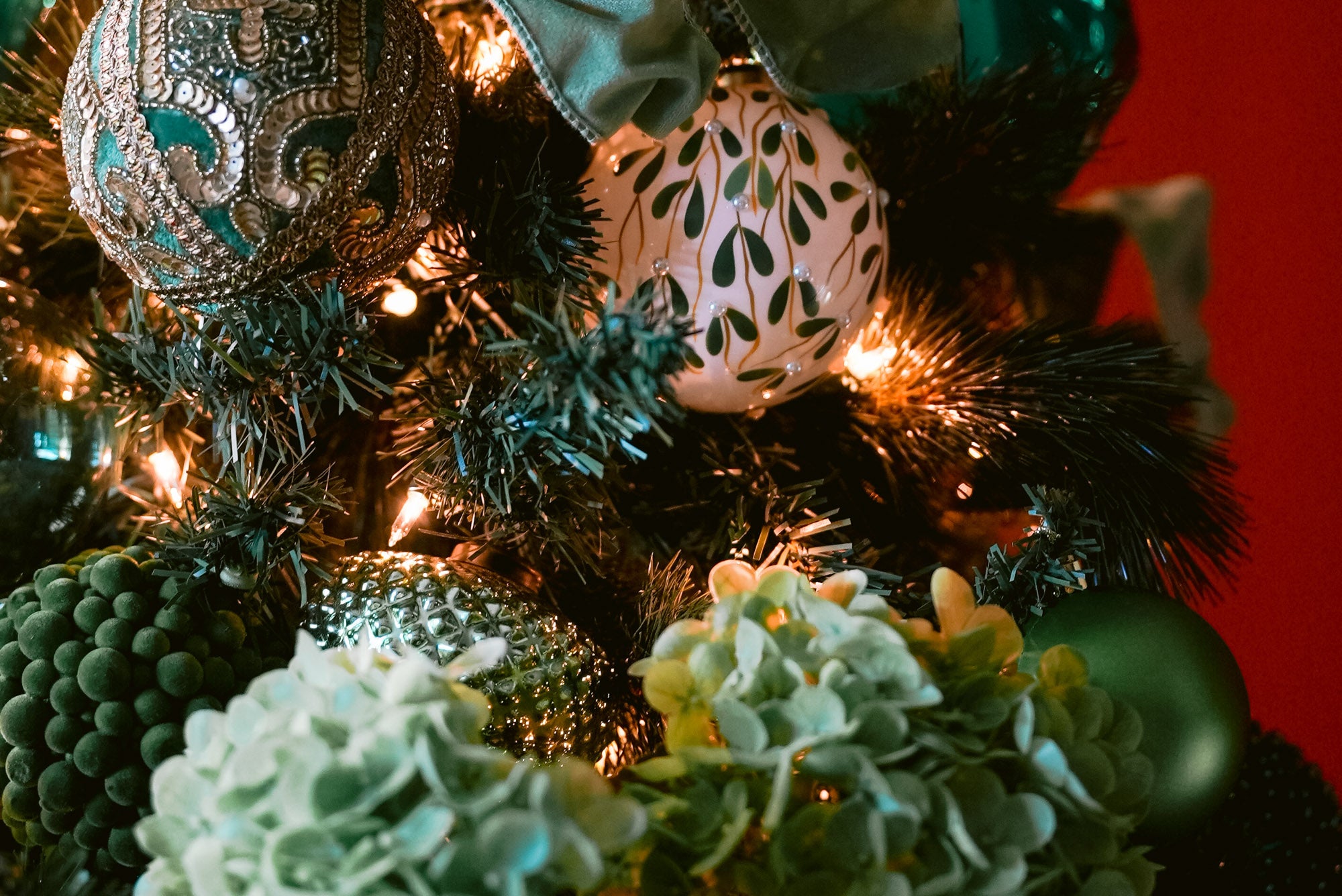 Green Christmas Tree  - close up of green and white ornaments 