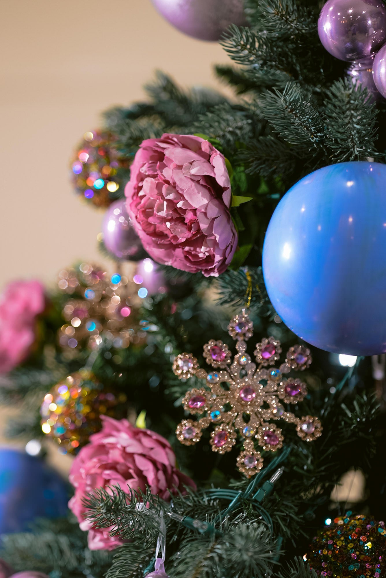 Purple Christmas tree - close up of pink roses and purple ball ornaments for purple Christmas tree 